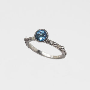 Unique silver ring with blue topaz stone